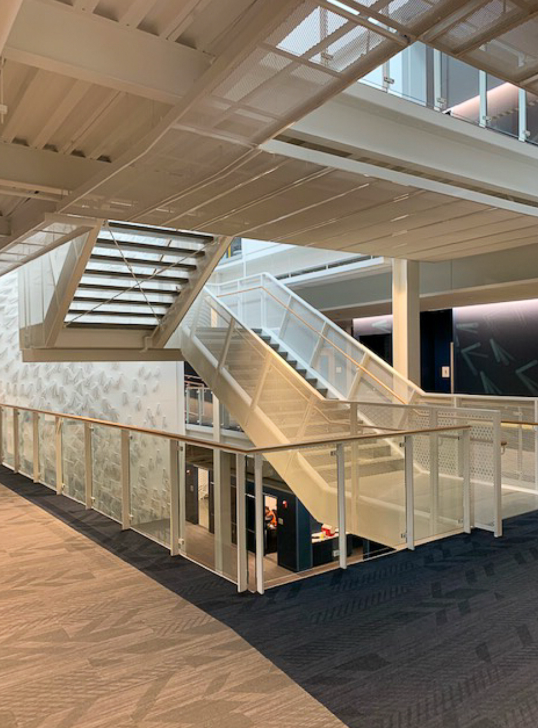 MAB & Associates North - custom glass railing staircase installation